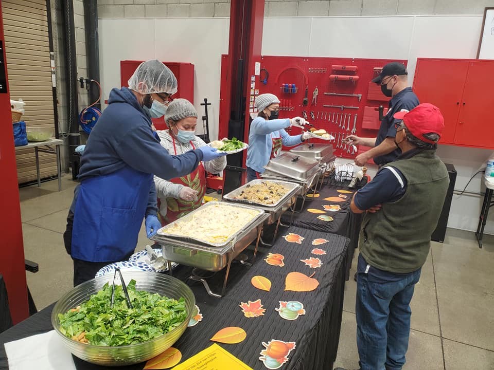 Ronnie and Team serving Thanksgiving dinner at Costco