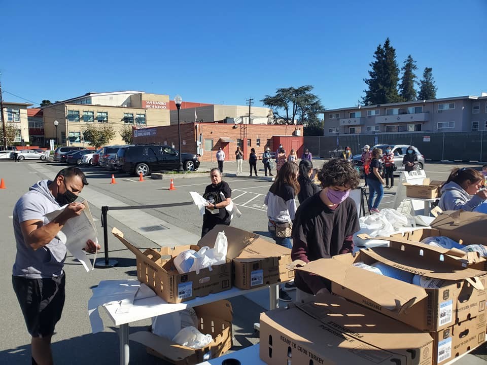 volunteers distribute food for Thanksgiving